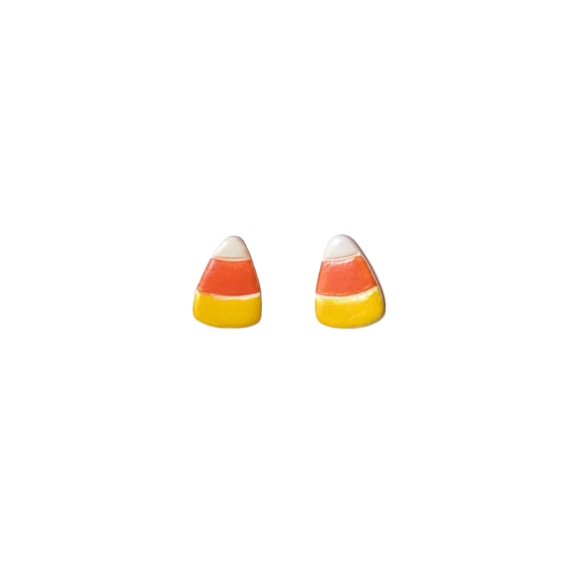 Candy corn-shaped earrings on a white background
