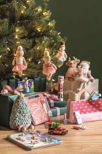 Mud Pie Holiday Plush Pals styled under a Christmas tree with gifts