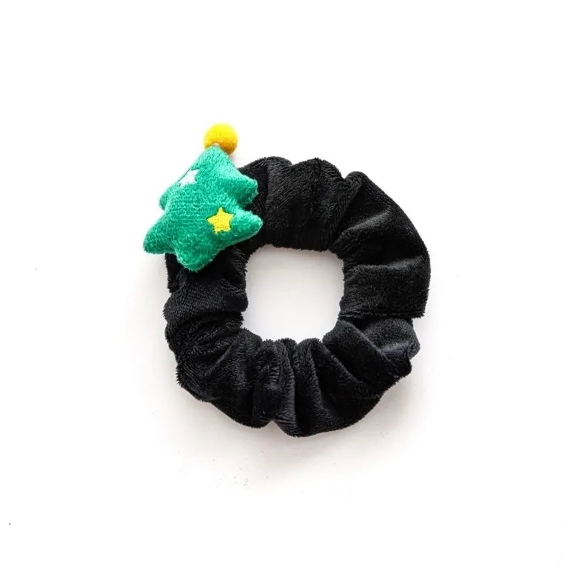 Black velvet hair scrunchie with a green plush Christmas tree and yellow star