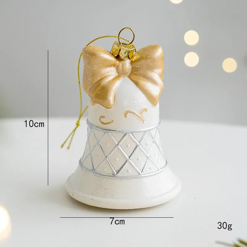 White and gold glitter resin Christmas bell ornament with gold bow and mesh pattern