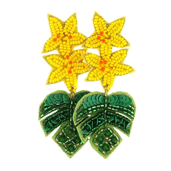Dangle earrings with two yellow flowers with monstera leafs underneath