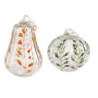 Mud Pie painted glass pumpkin sitters shown in both sizes