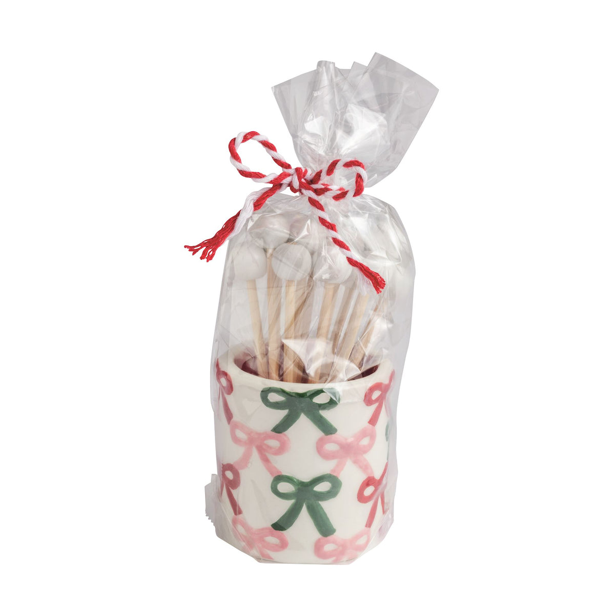 Mud Pie repeat bows pattern ceramic toothpick caddy with toothpicks in a tied cello bag