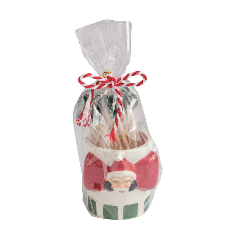 Mud Pie Santa ceramic toothpick caddy with toothpicks in a tied cello bag