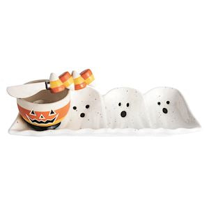 Halloween-themed ceramic set with ghost figures and candy corn on a white background