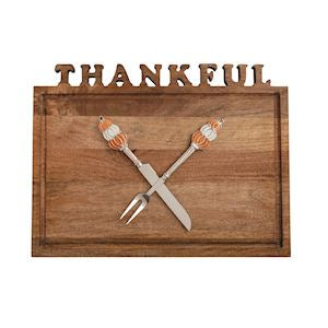 Wooden wall art with 'THANKFUL' text, crossed utensils, and small bows on a white background.