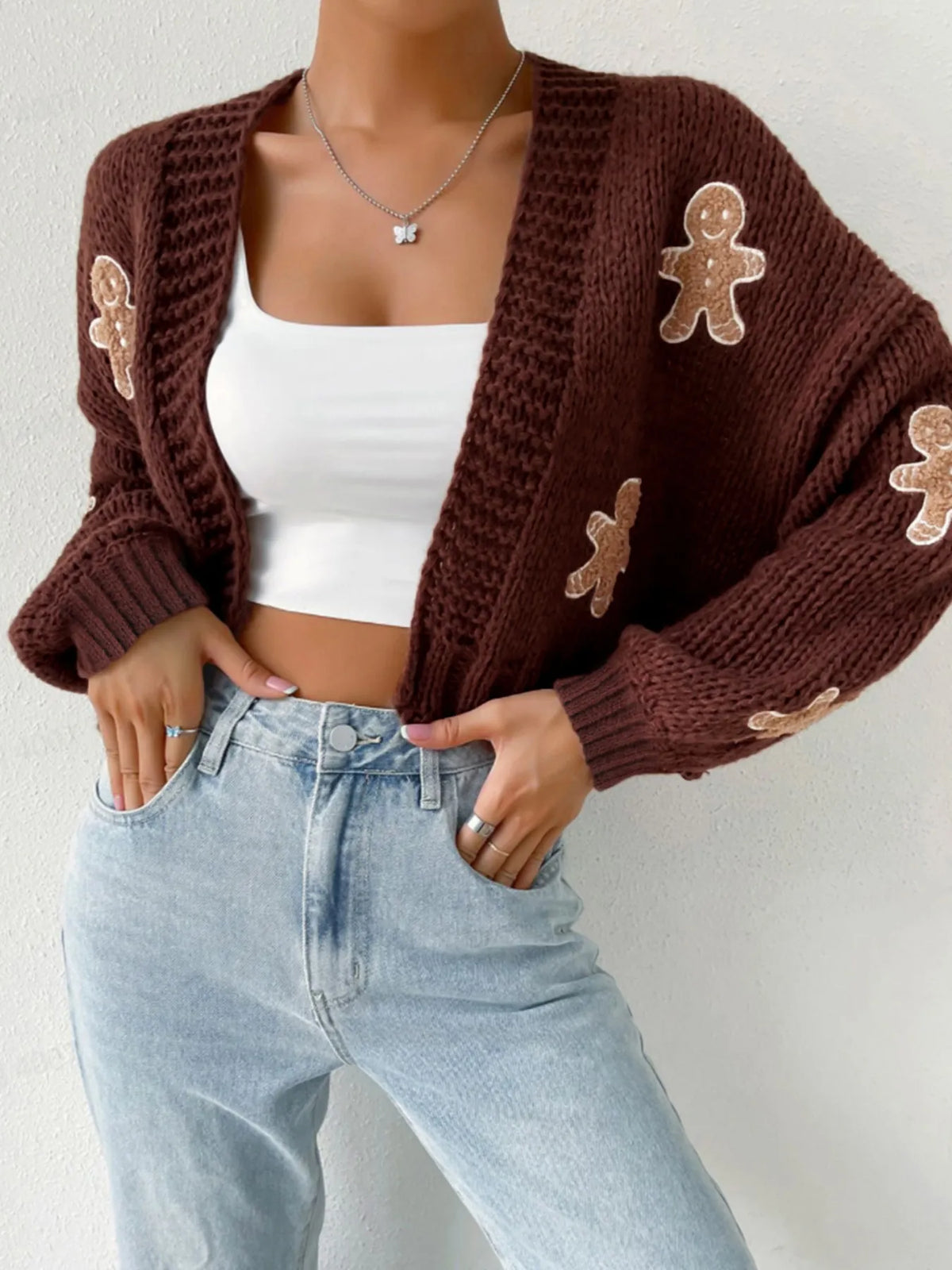 Brown V-neck cropped knit cardigan with cute gingerbread man appliqués