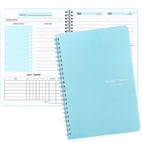 Blue spiral-bound undated weekly planner with habit tracker layout