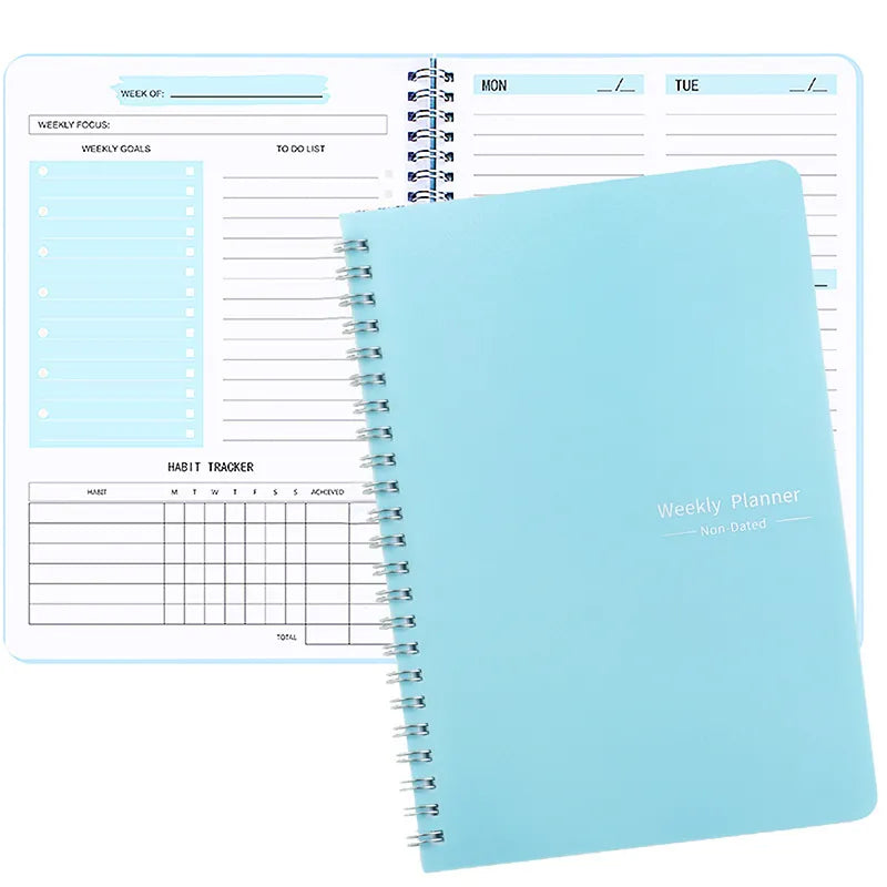 Blue spiral-bound undated weekly planner with habit tracker layout