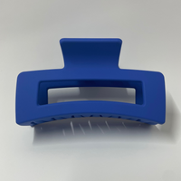 Blue hair clip on a white background