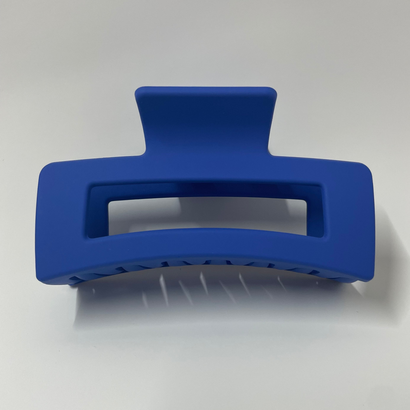Blue hair clip on a white background