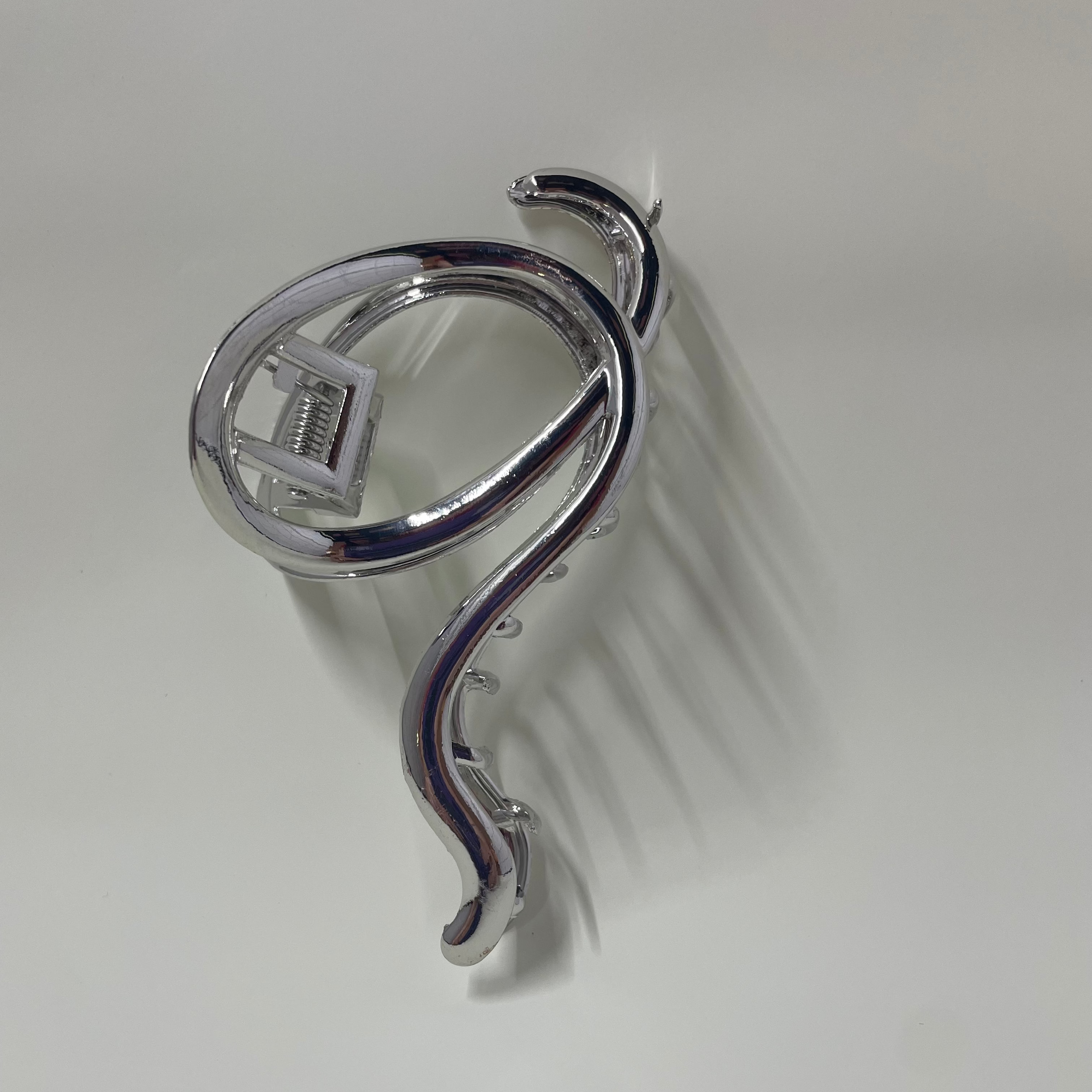Silver hair clip on a white background