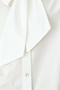 MODERN STATEMENT BOW WOVEN TOP
