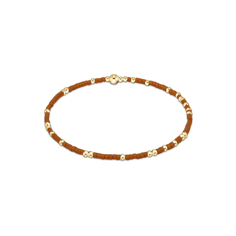 Burnt Orange beaded necklace with gold accents on a white background