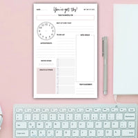 Daily planner sheet with habit tracker and pink color blocks