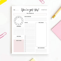 Pink daily planner notepad with schedule and task tracker