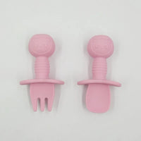 Pink silicone baby training fork and spoon set with cute panda character handles