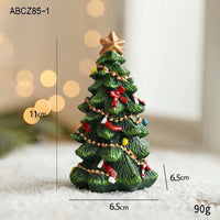 Miniature hand-painted resin Christmas tree figurine with gold star and red bows