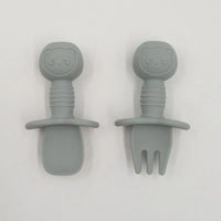 Gray food-grade silicone baby training fork and spoon set with panda handles and anti-choke guard