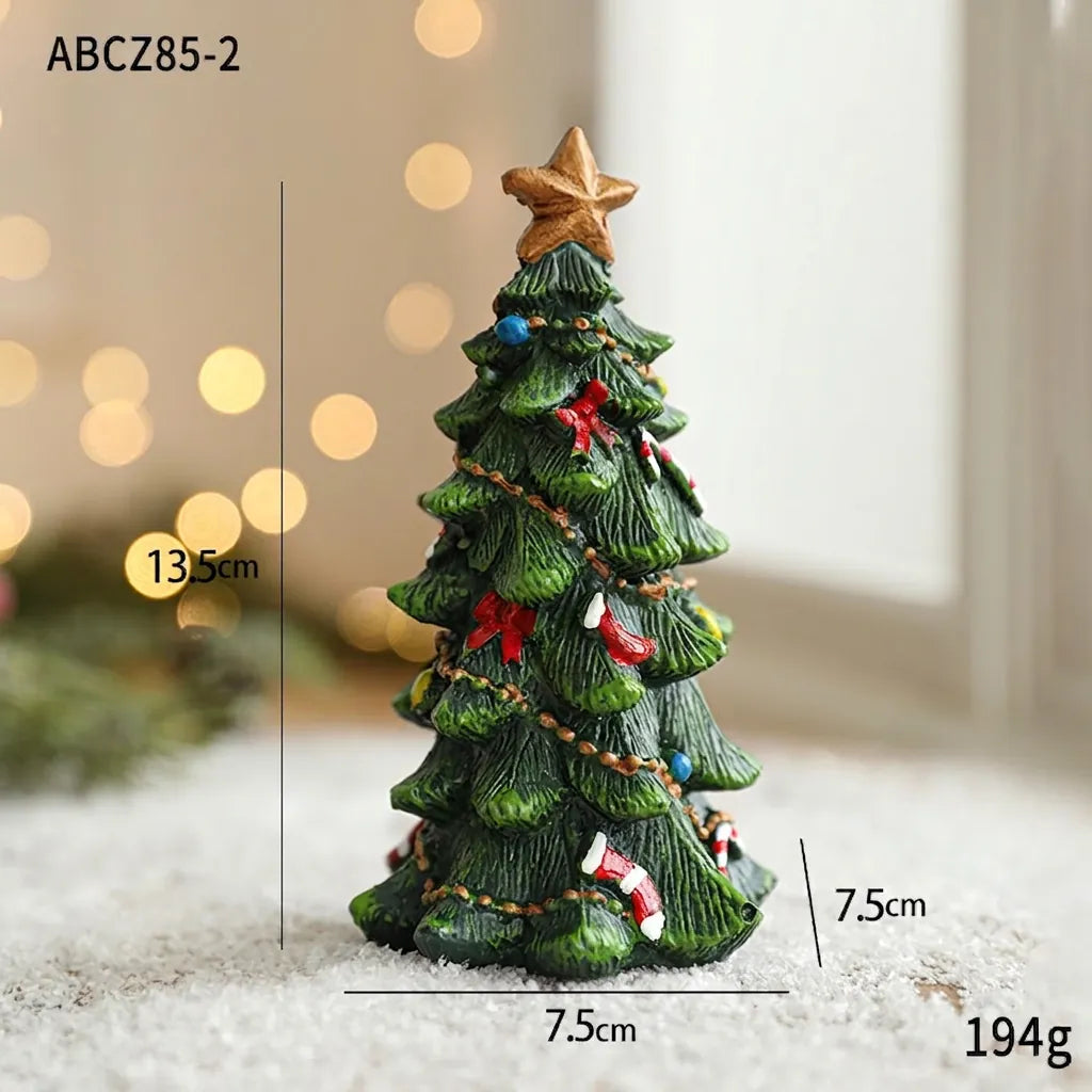 Larger miniature resin Christmas tree figurine with gold star, red bows and ornaments