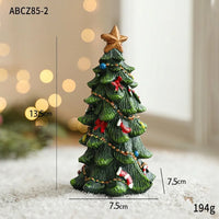 Larger miniature resin Christmas tree figurine with gold star, red bows and ornaments