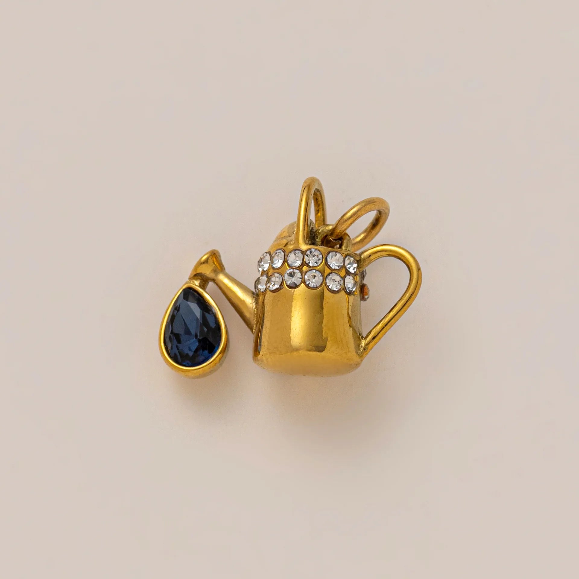 18K gold plated teapot charm pendant with a blue gemstone and crystal details