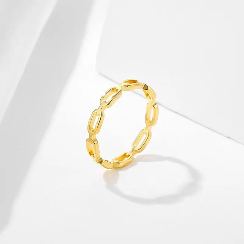 Gold titanium steel hollow chain link ring with a polished mirror finish