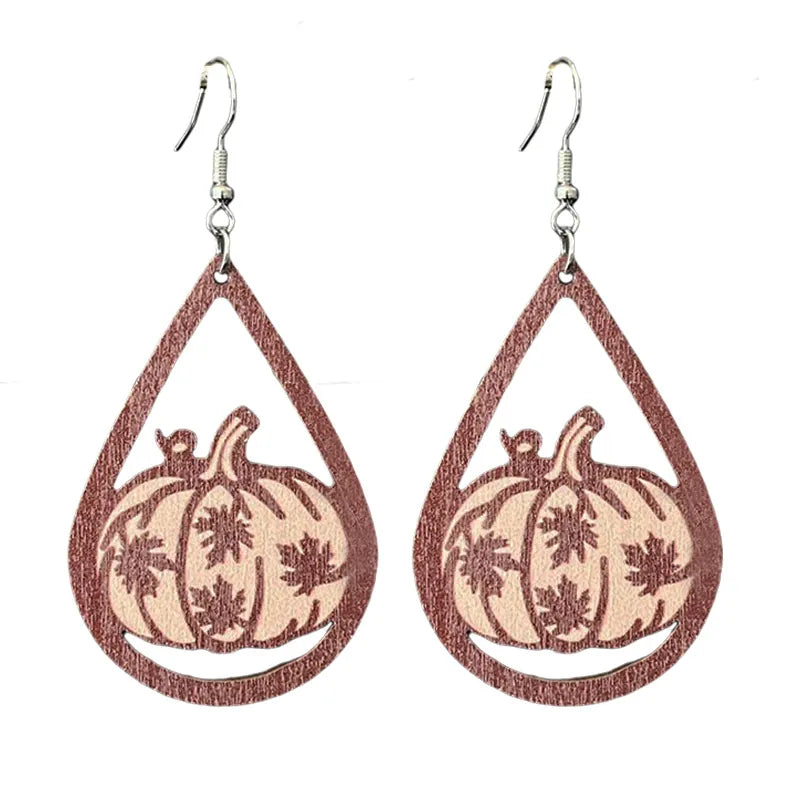 Wooden teardrop dangle earrings with pumpkin and maple leaf patterns in autumn tones