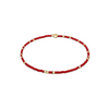 Red beaded bracelet with gold beads on a white background
