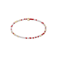 Bracelet with red and white beads on a white background