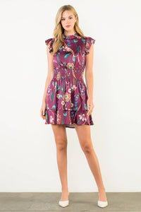 Woman wearing a floral dress on a white background