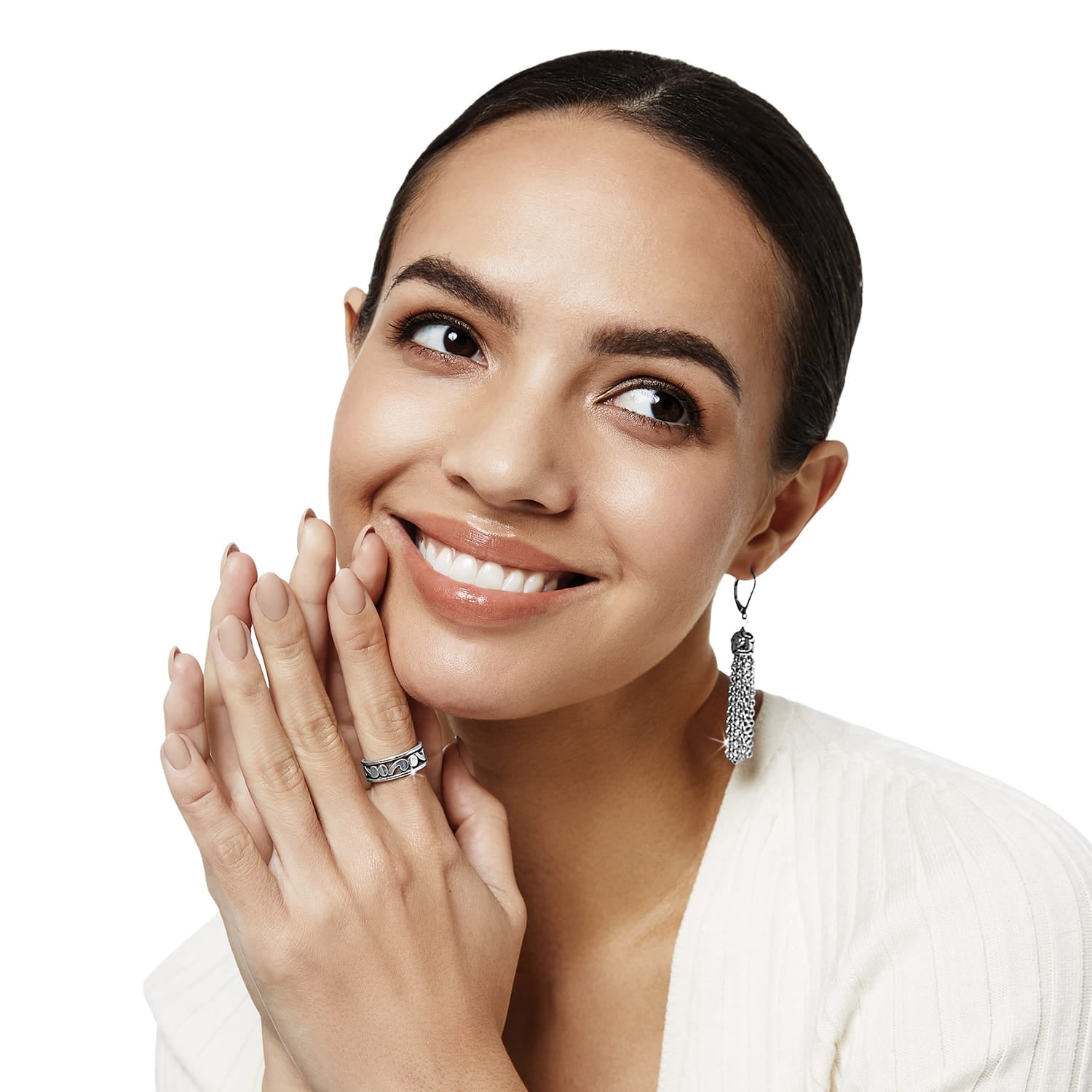 Model wearing a Brighton silver-plated band ring with scroll detail paired with silver-plated tassel drop earrings