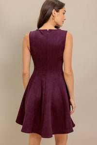 woman wearing a burgundy dress facing backwards