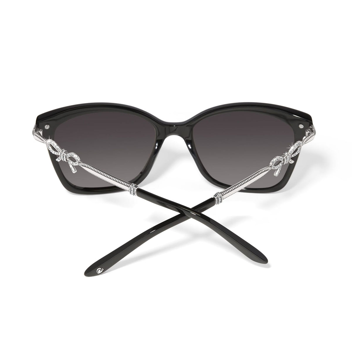 Brighton black sunglasses shown from the back with silver-tone crystal bow accents and engraved temples