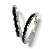 Brighton hoop earrings with black enamel inlay and silver-plated ribbed edges on a white background