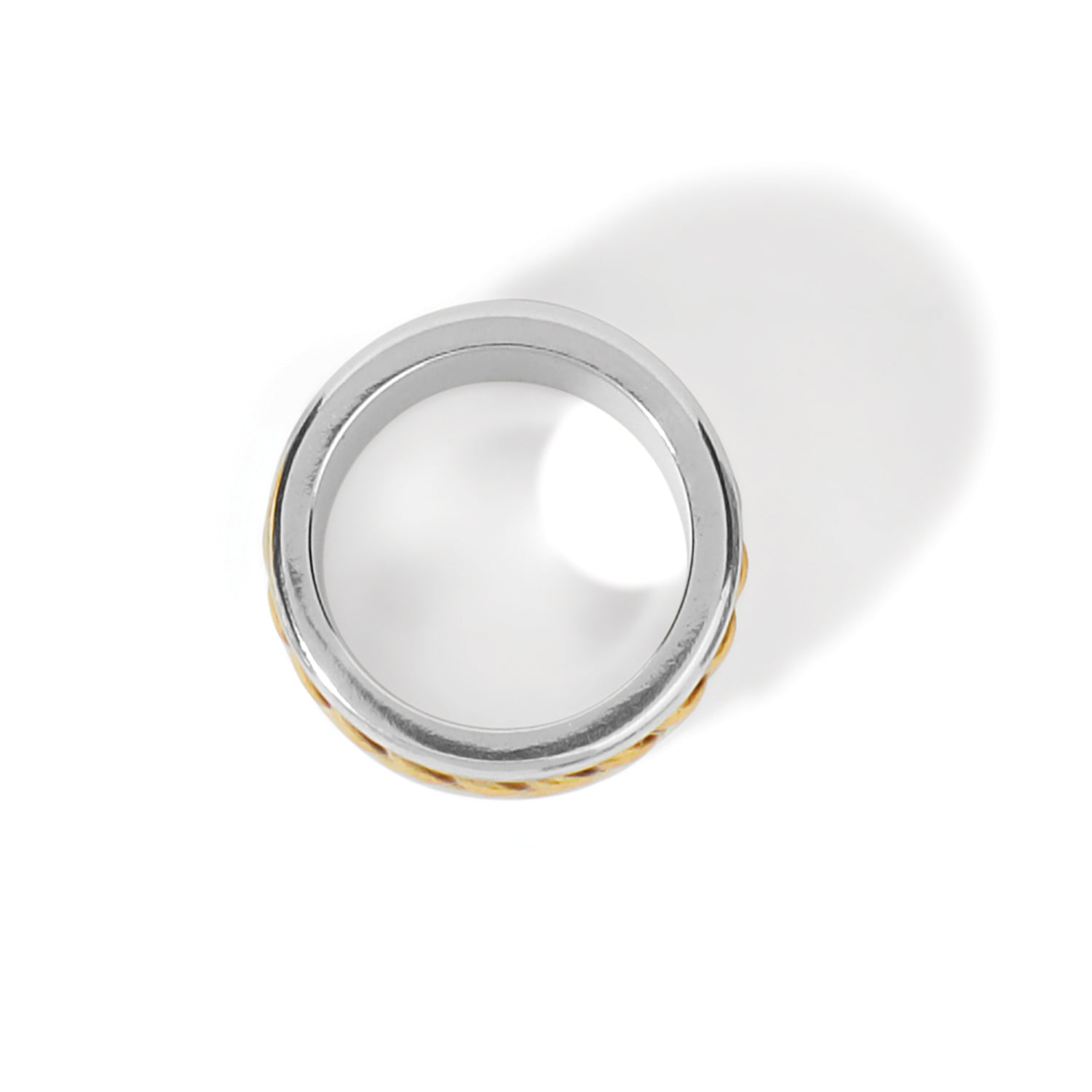 Brighton ring shown from above with two-tone silver band and gold textured edge on a white background