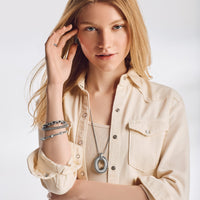 Model wearing Pretty Tough Link Pendant Necklace with coordinating Brighton pieces