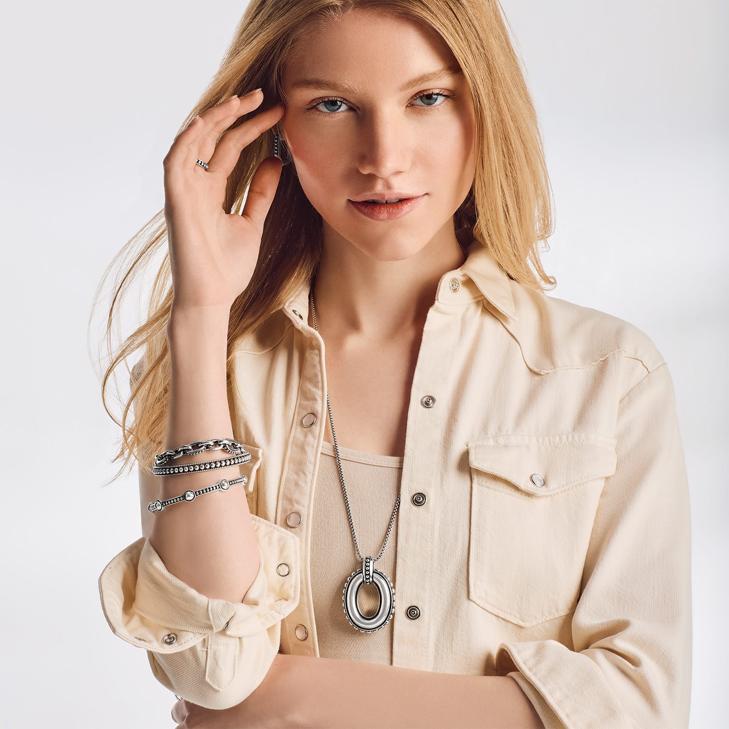 Model wearing Pretty Tough Link Pendant Necklace with coordinating Brighton pieces