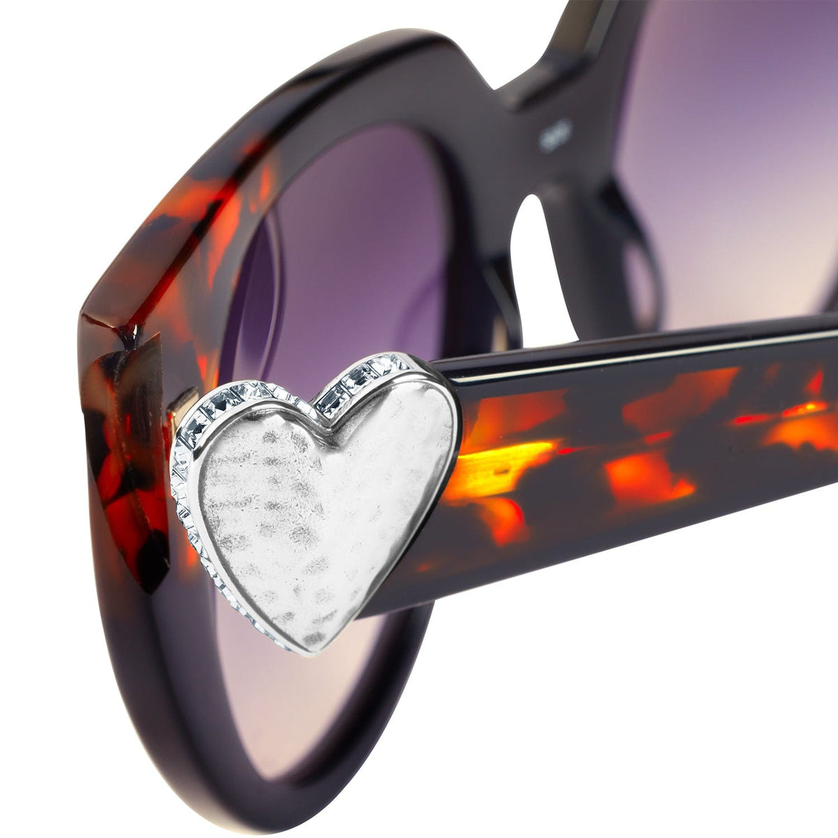 Close-up of Brighton sunglasses tortoise frame with silver heart accent and crystal trim