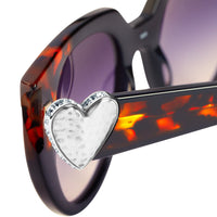 Close-up of Brighton sunglasses tortoise frame with silver heart accent and crystal trim