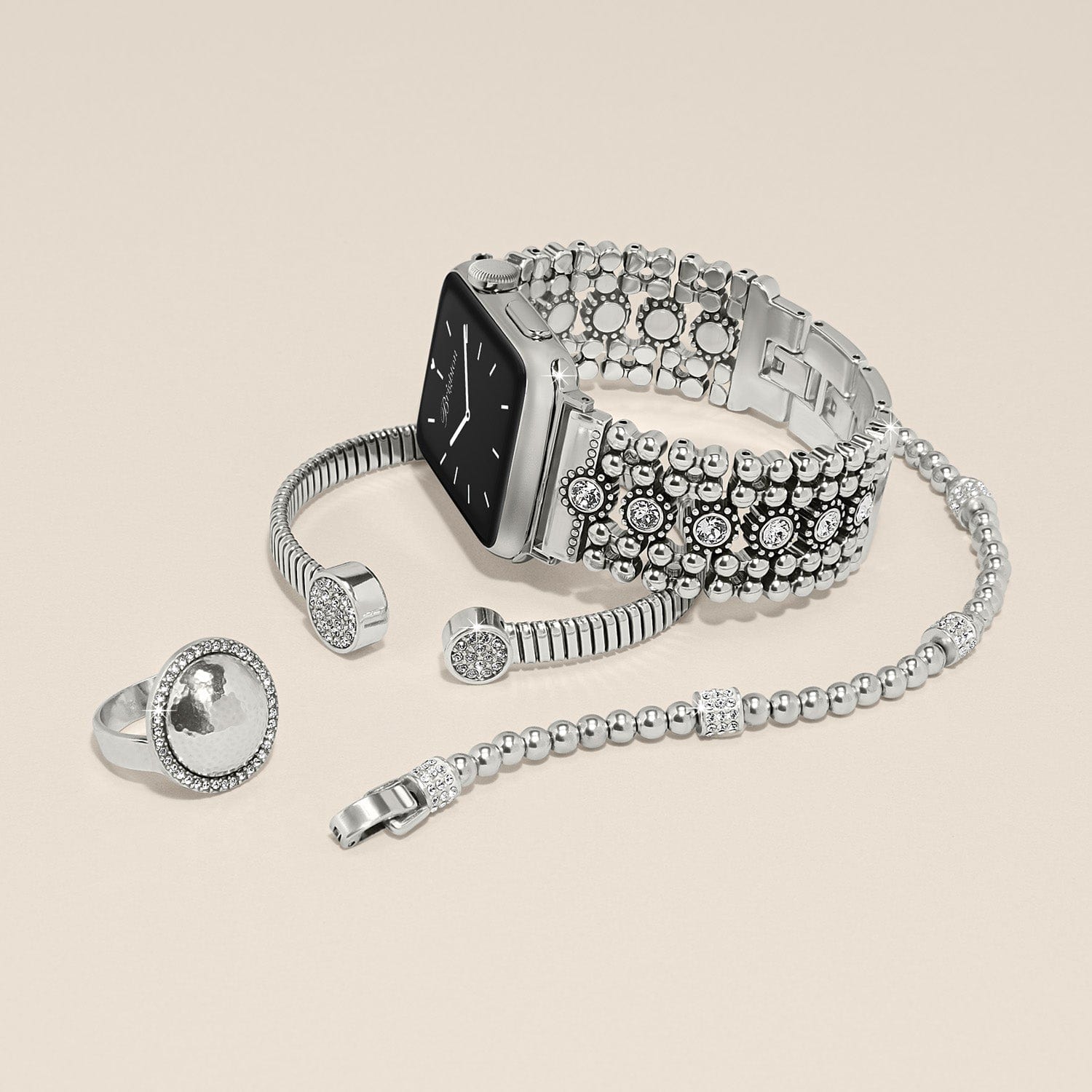 Twinkle Link Watch Band styled with crystal-accented bracelets and hammered ring